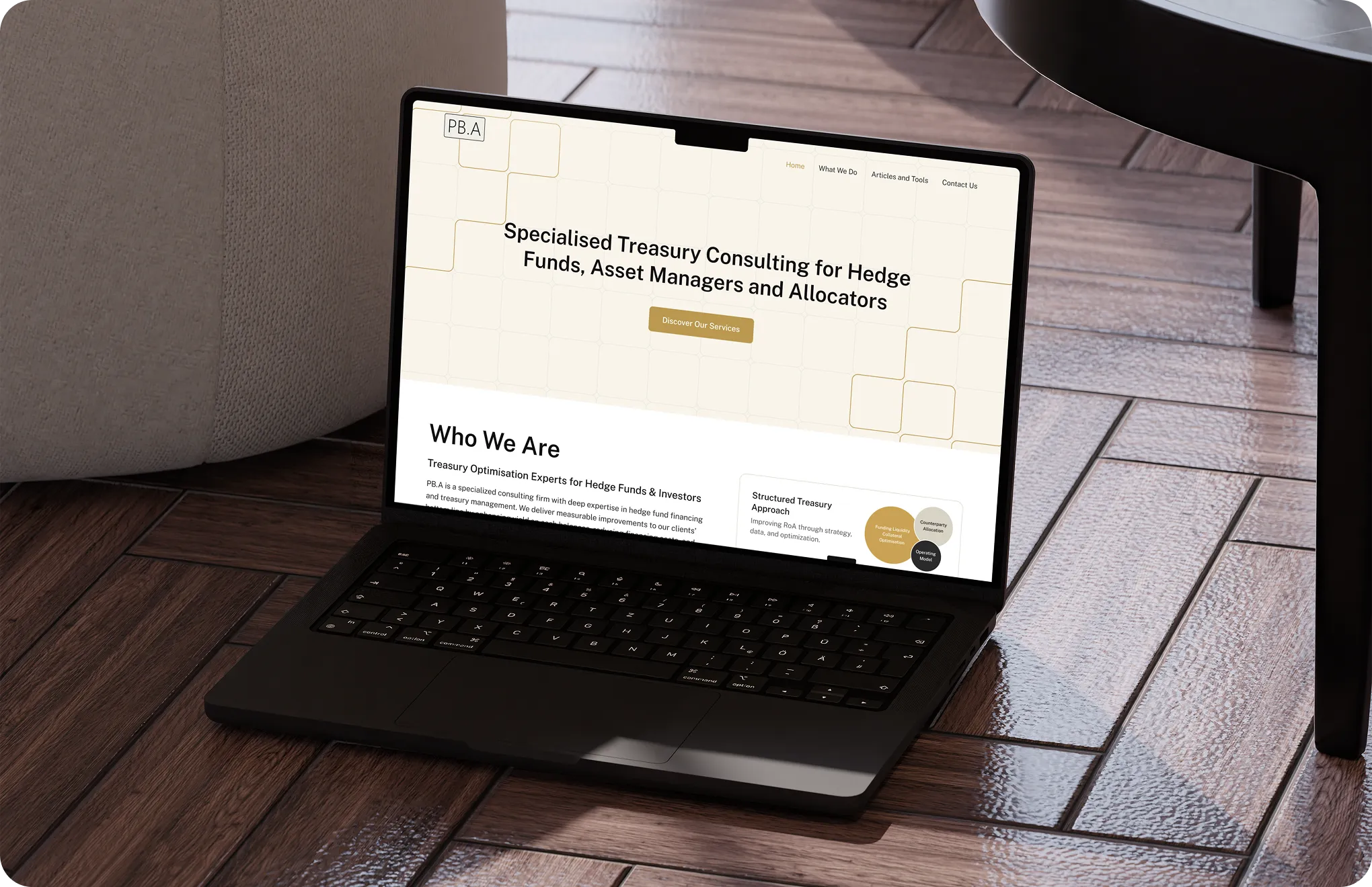 Laptop on wooden floor showing a consulting website focused on treasury services for hedge funds.