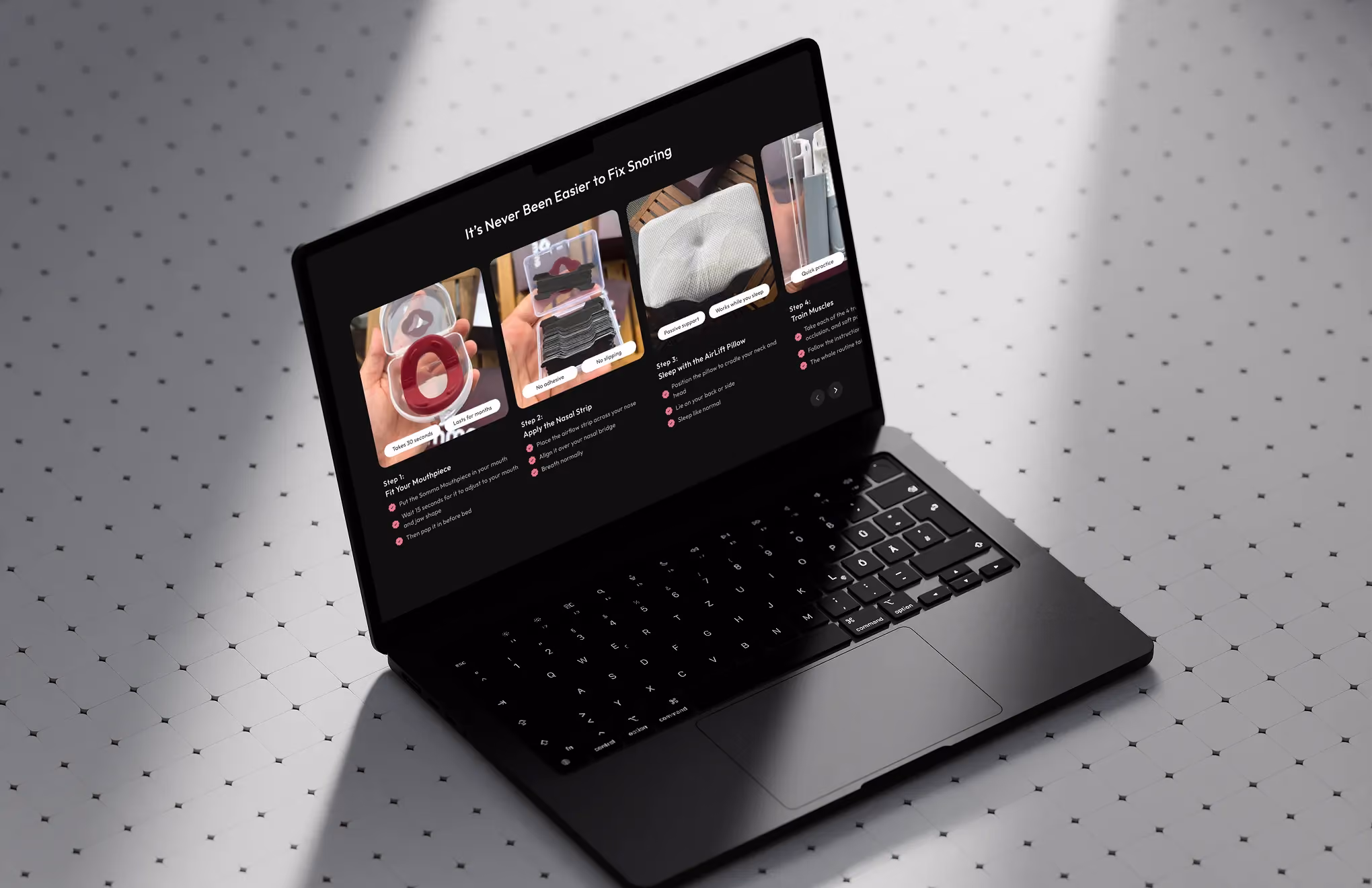 Open laptop on tiled surface displays snoring remedy steps with images of mouthpiece, nasal strip, and pillow.