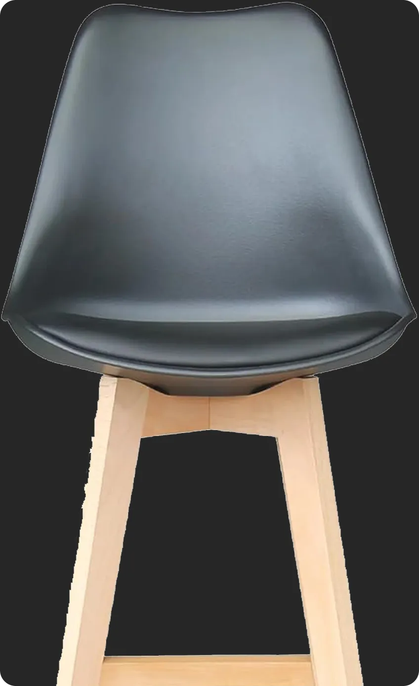 Modern chair with black seat and light wooden legs on a dark background.