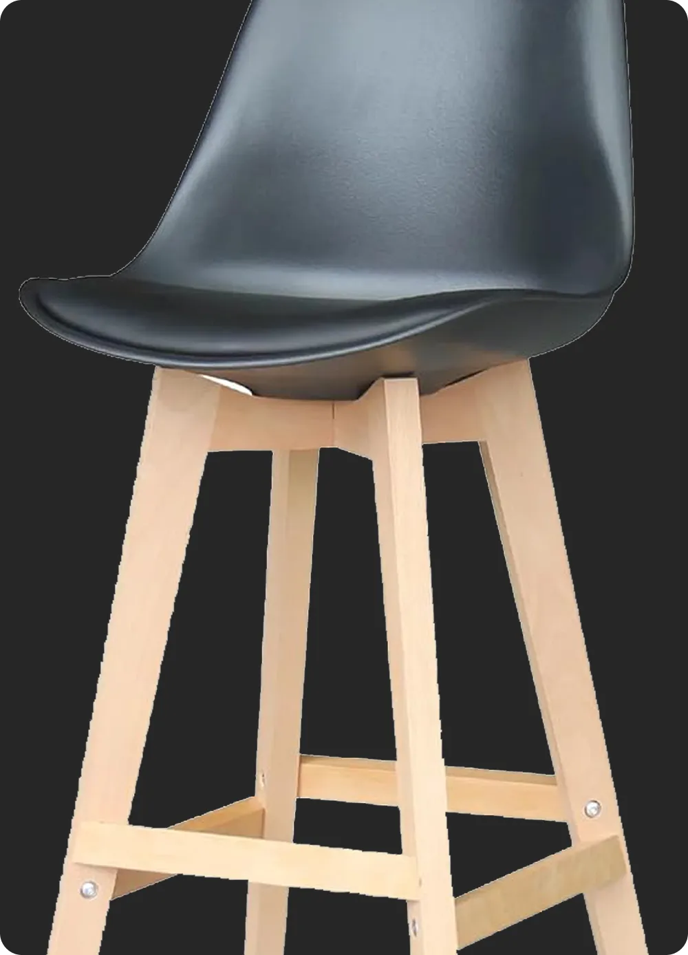 Bar stool with a black curved seat and light wood legs against a dark background.