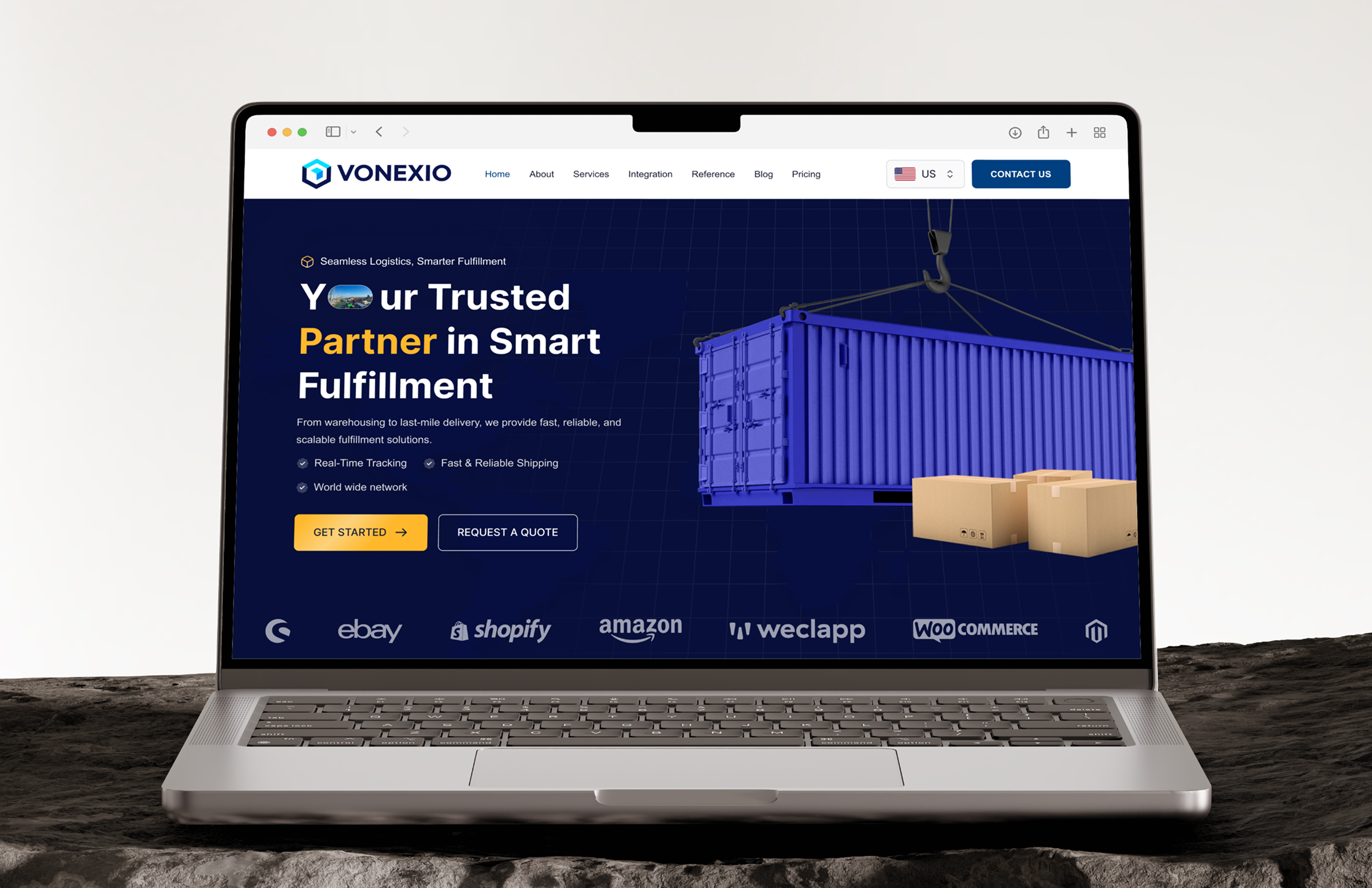 Laptop displaying Vonexio logistics website with blue shipping container and cardboard boxes.