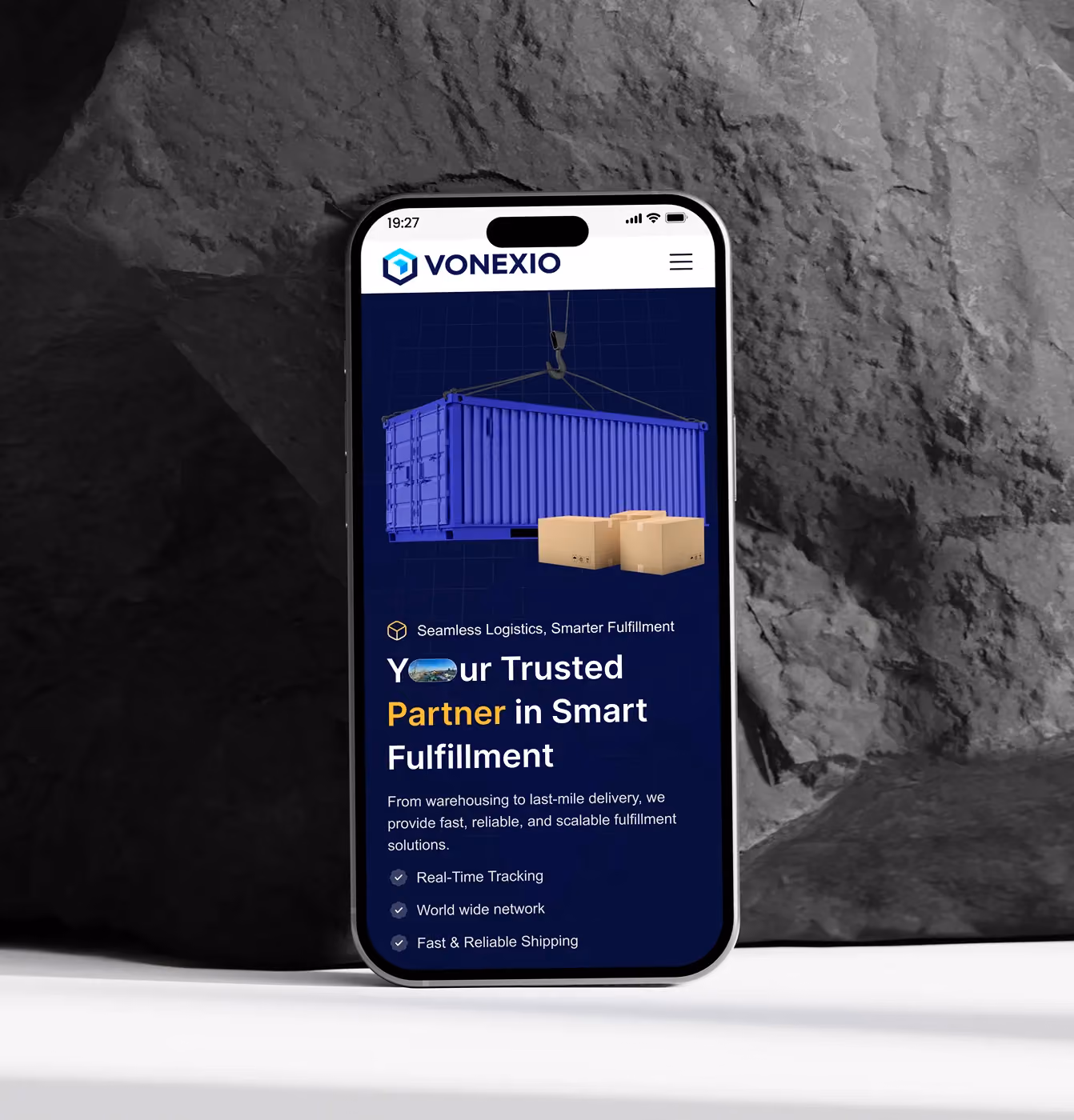 Smartphone showing Vonexio logistics site with container, boxes, and fulfillment service features listed.