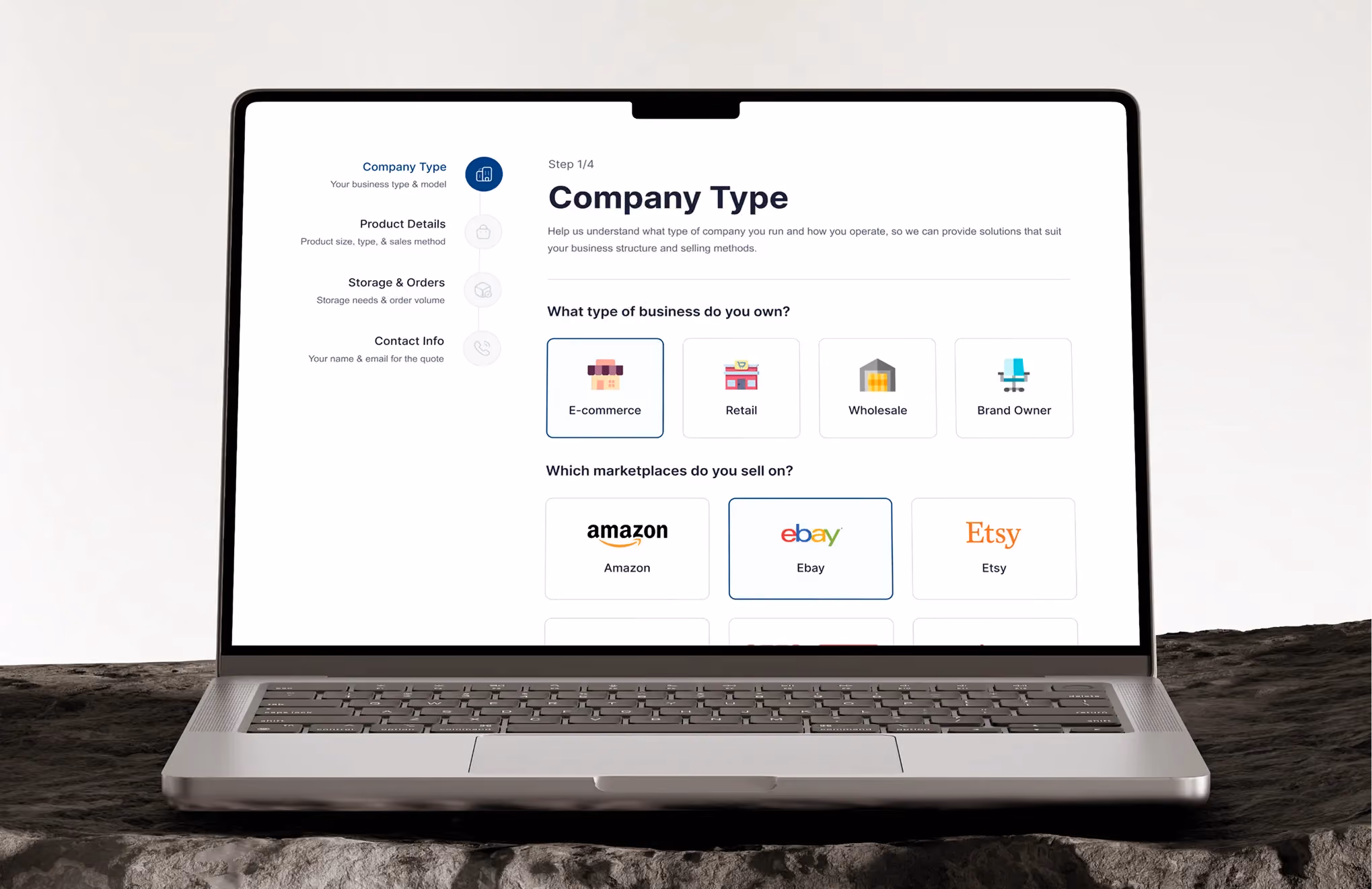 Laptop screen showing a company type selection form with business and marketplace options.