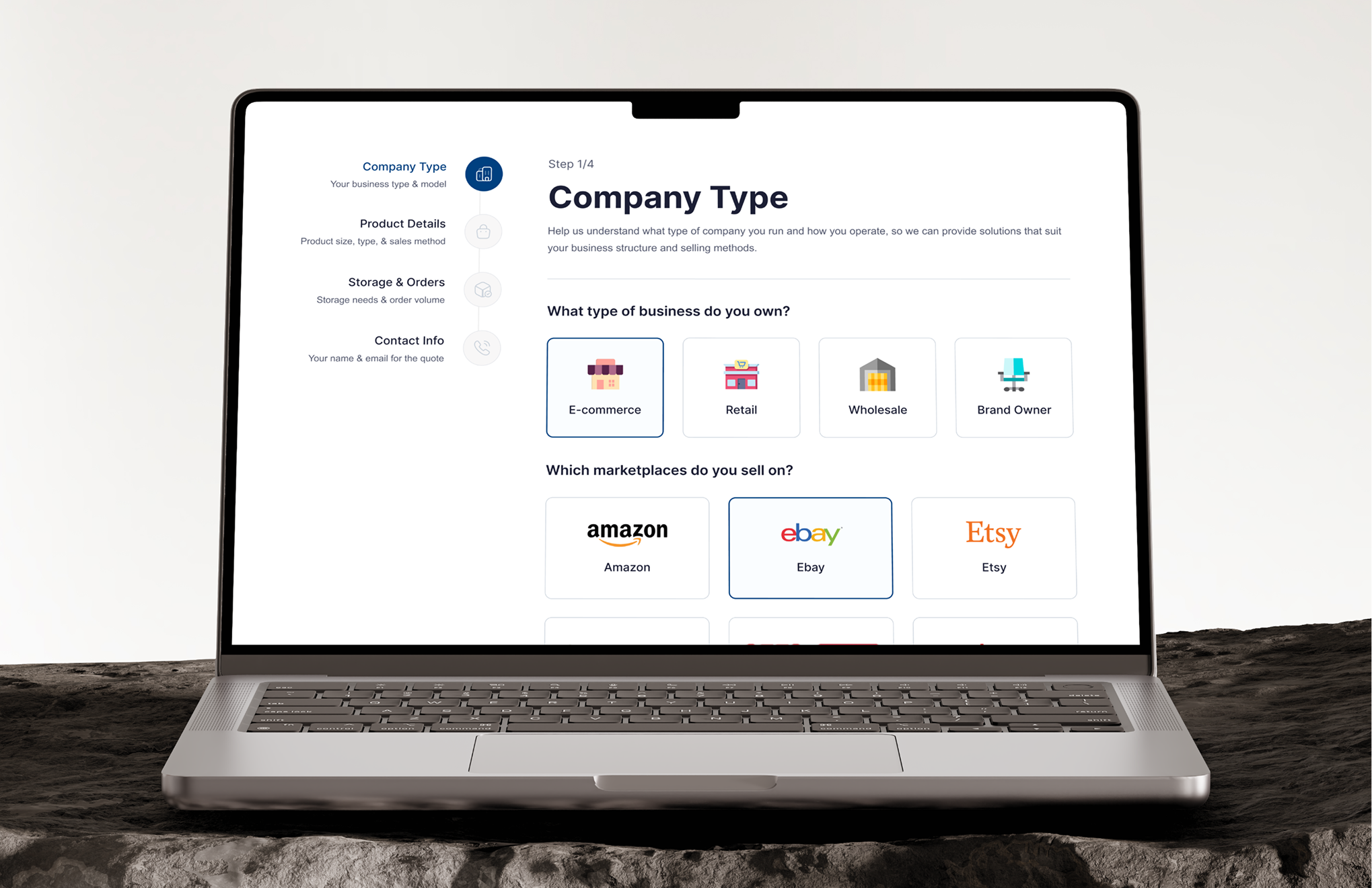 Laptop screen showing a company type selection form with business and marketplace options.
