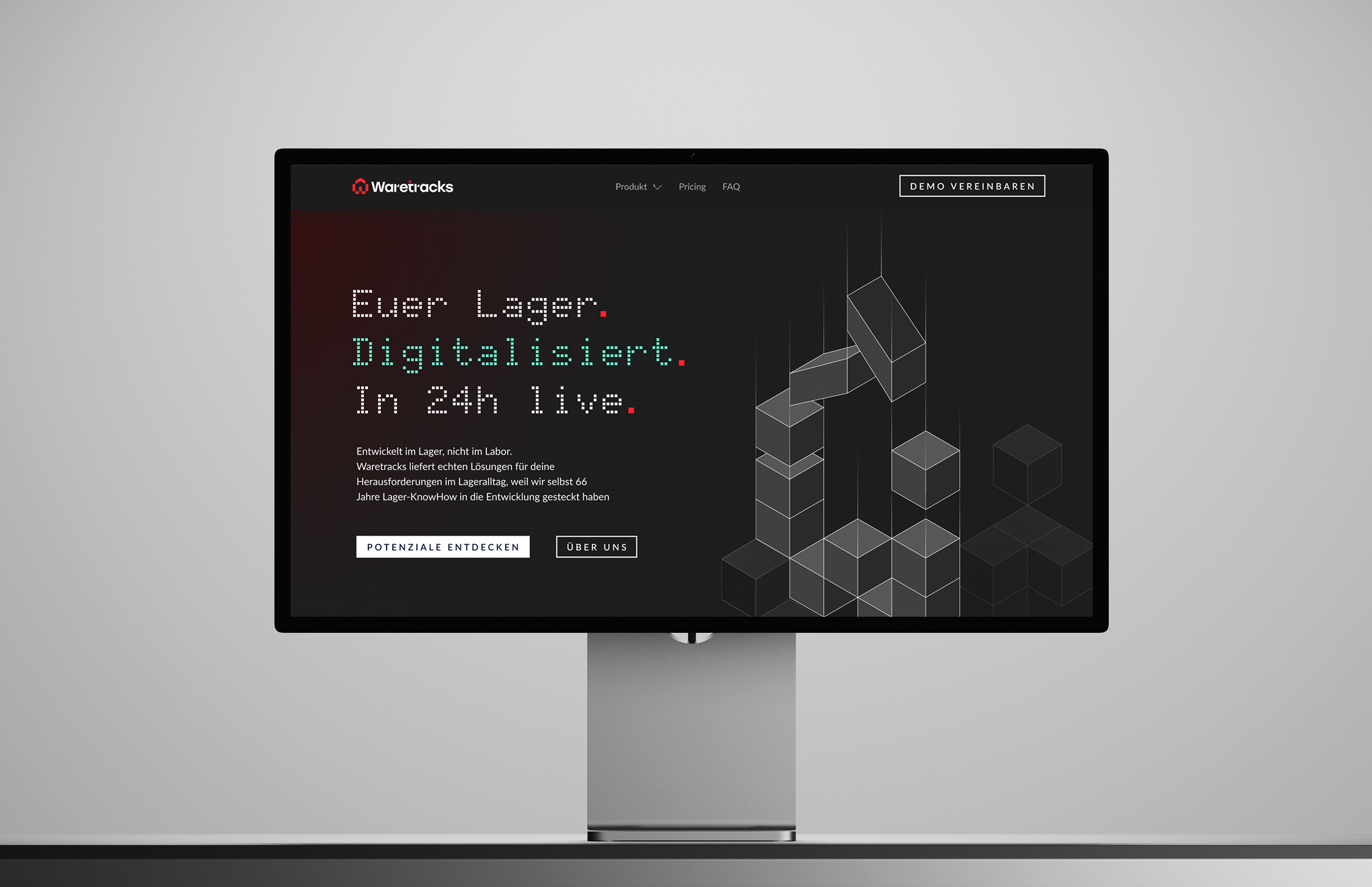 Computer screen showing Waretracks website with text about digitalizing warehouse in 24 hours and a geometric cube design.