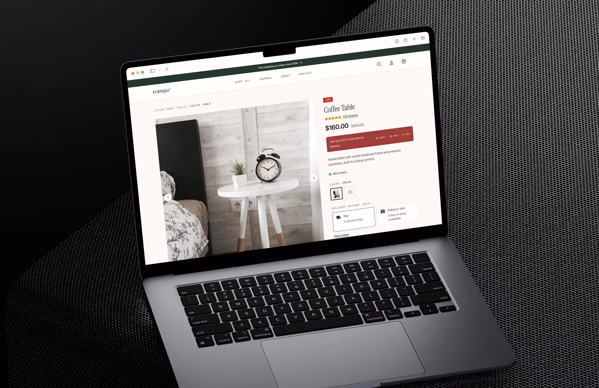 Laptop screen displaying a coffee table product page with price, reviews, and shipping options.