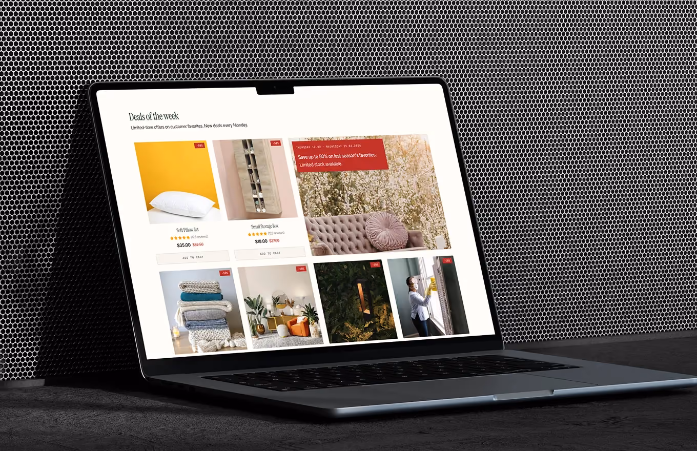 Open laptop showing an online store page with deals of the week and product images with prices.