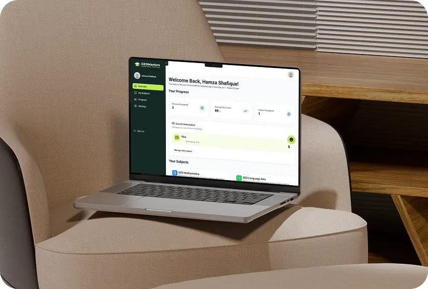 Silver laptop displaying an educational dashboard with user progress and subscription details on a beige cushioned chair.