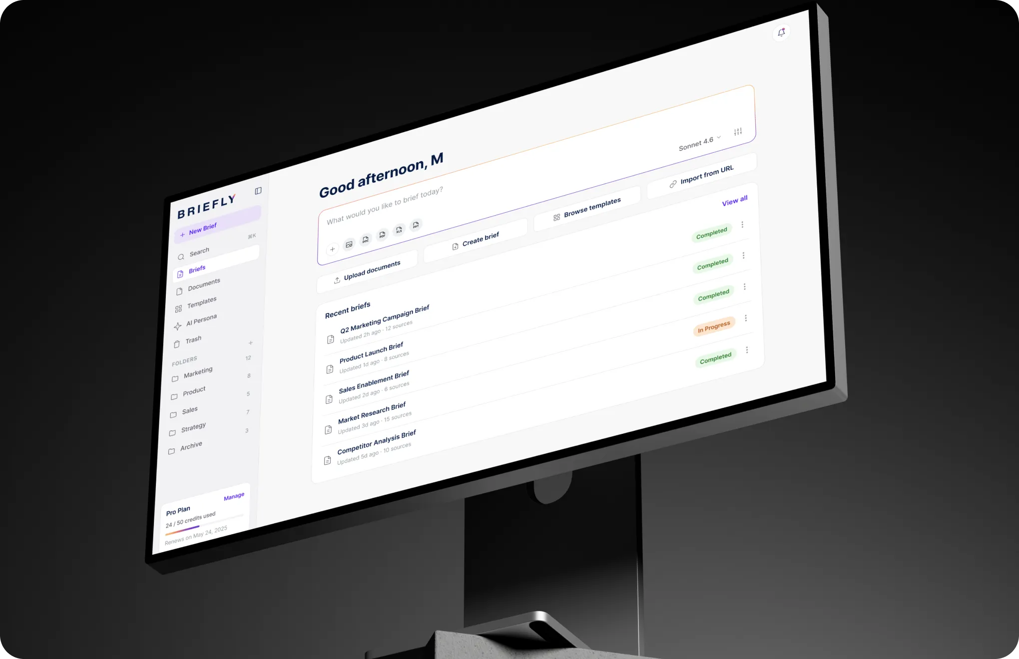 Briefly home screen on a desktop monitor with the brief prompt, upload and template shortcuts, and recent briefs listed by status and source count