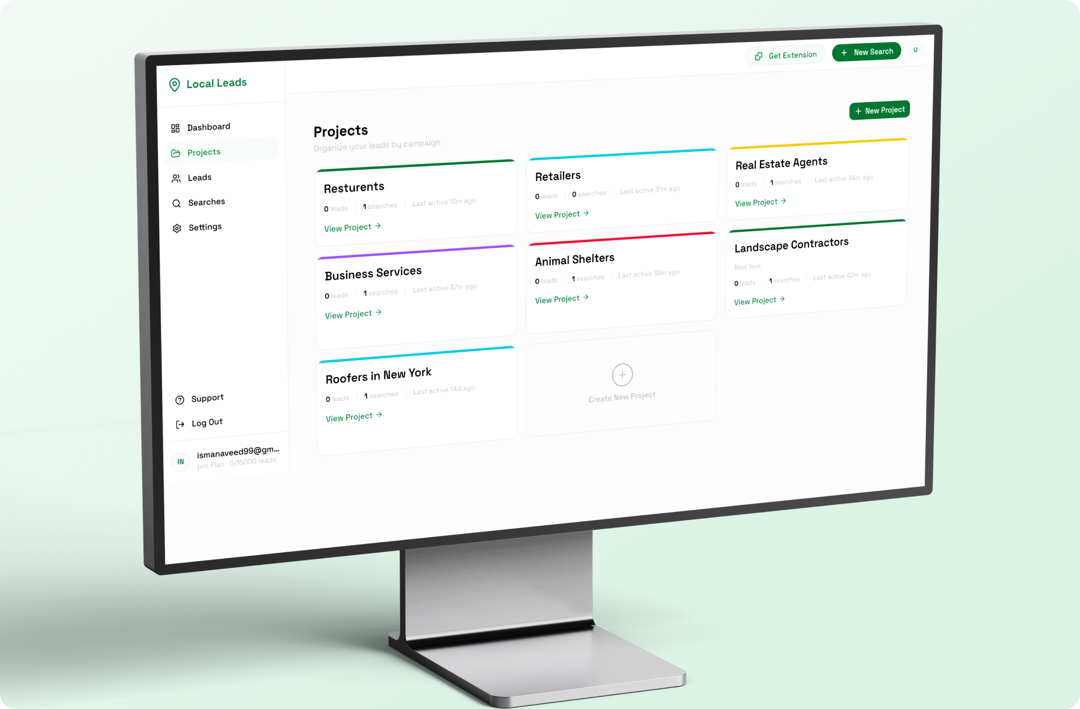 Laptop showing the LuxStay user management screen listing guests, hosts and admins with bookings, spend and account status