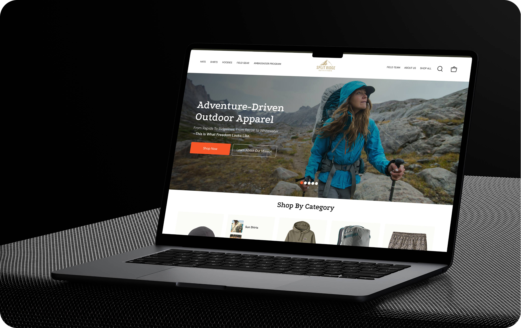 Split Ridge Outfitters Shopify store homepage with the headline Adventure-Driven Outdoor Apparel, shown on a laptop