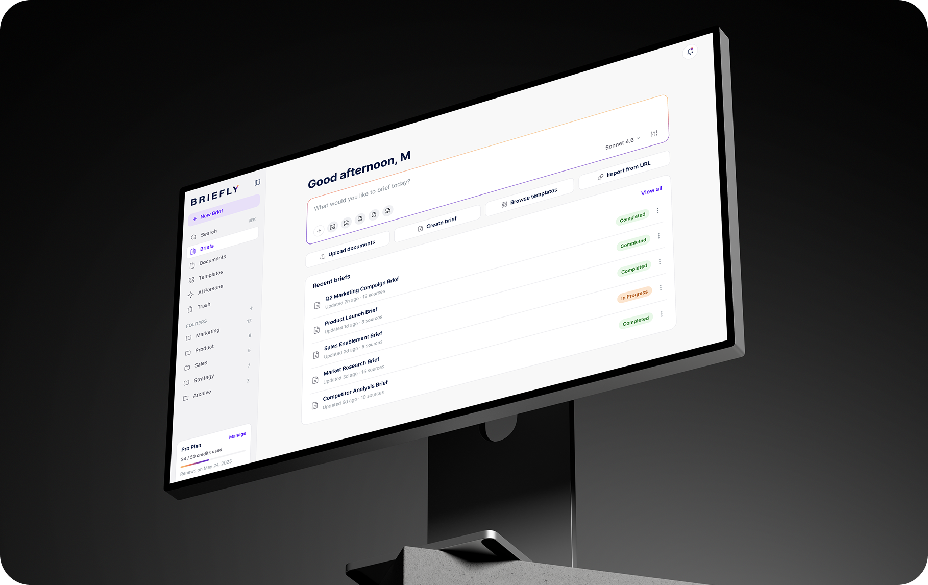 Briefly AI workspace dashboard showing recent briefs and their status on a desktop monitor
