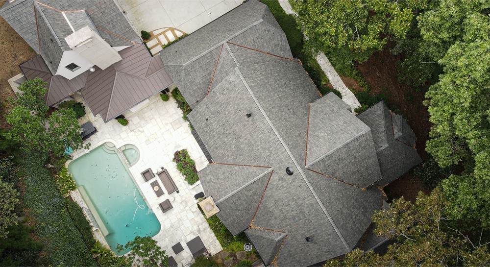 Aerial view of a composite shake roof with copper valleys