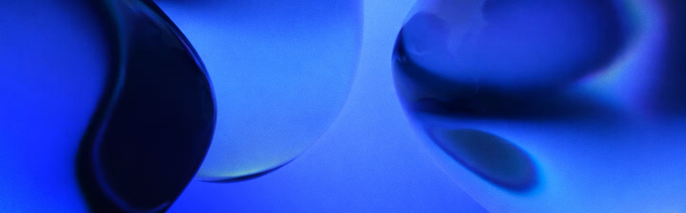 Abstract geometric gradient with dark blue and light blue triangular shapes converging at a point.