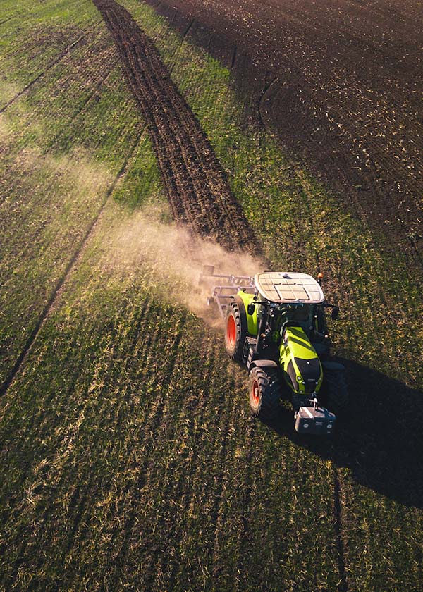 A farmer, undisrupted by Baybright Zero Cost Commercial Solar's installation process.