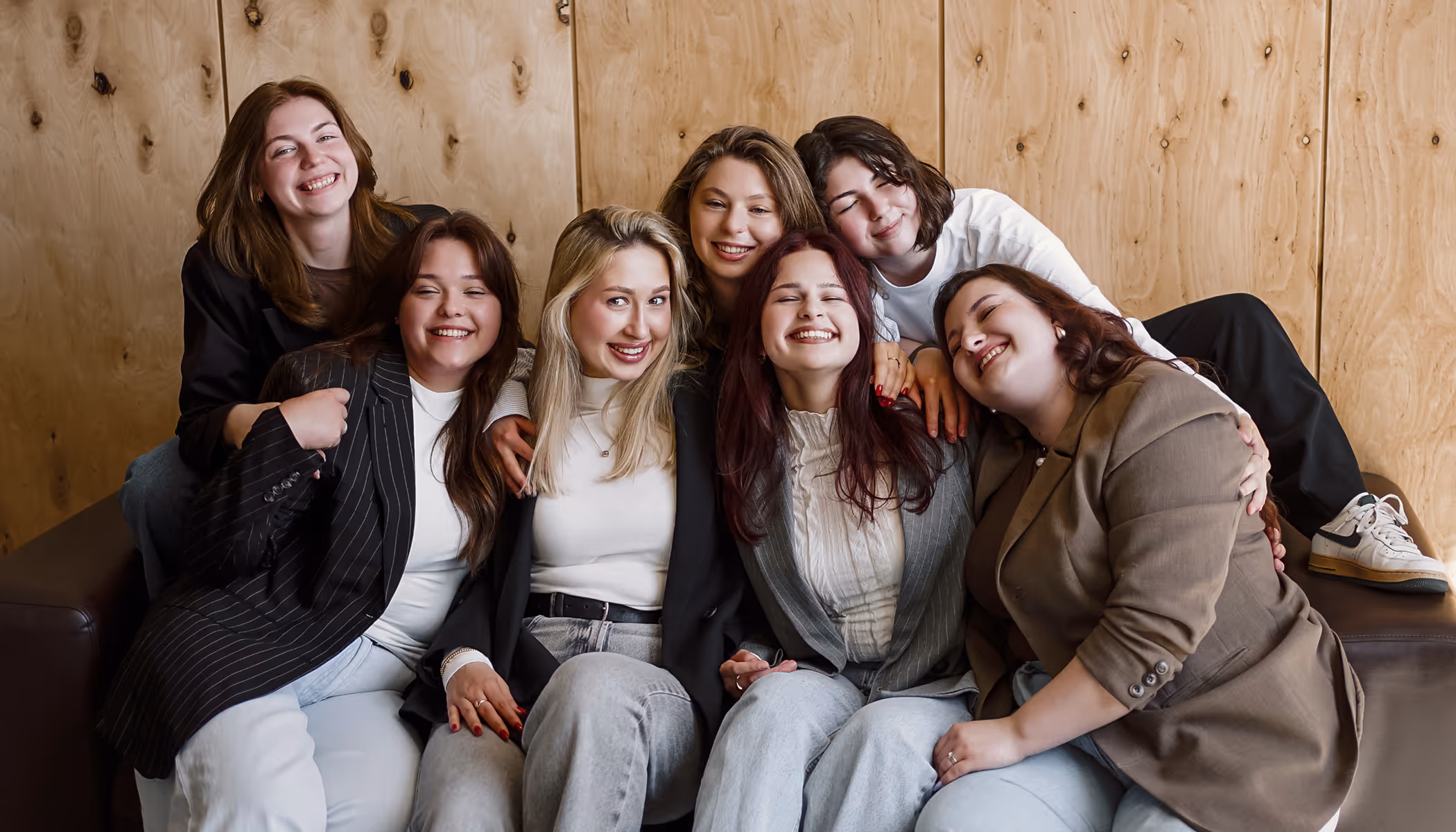 Simple English language school website hero — group portrait of female team