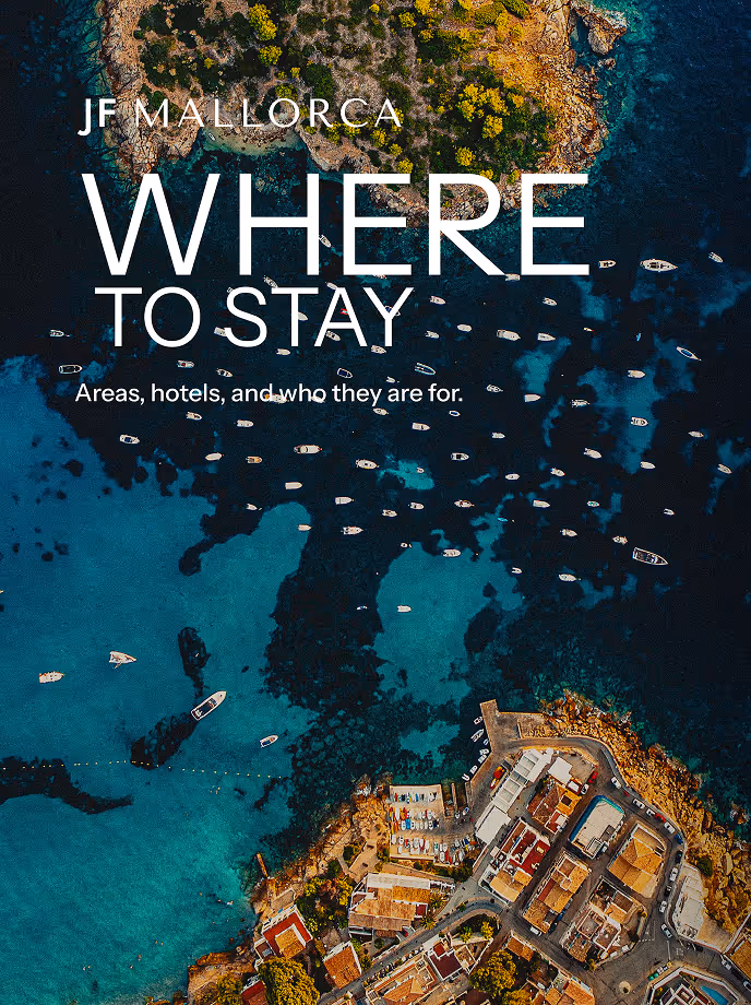 "Where to Stay" guide cover over a boat-dotted turquoise bay