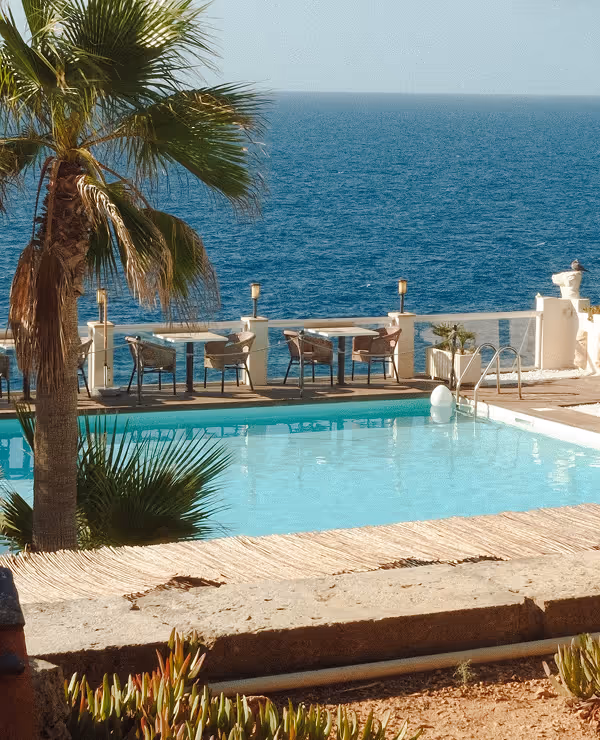 "The Mallorca Table" guide cover with a sunlit coastal landscape