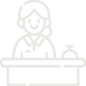 Icon of a person sitting behind a desk with a computer monitor and a lamp.