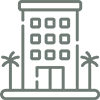 Icon of a multi-story building with palm trees on both sides.