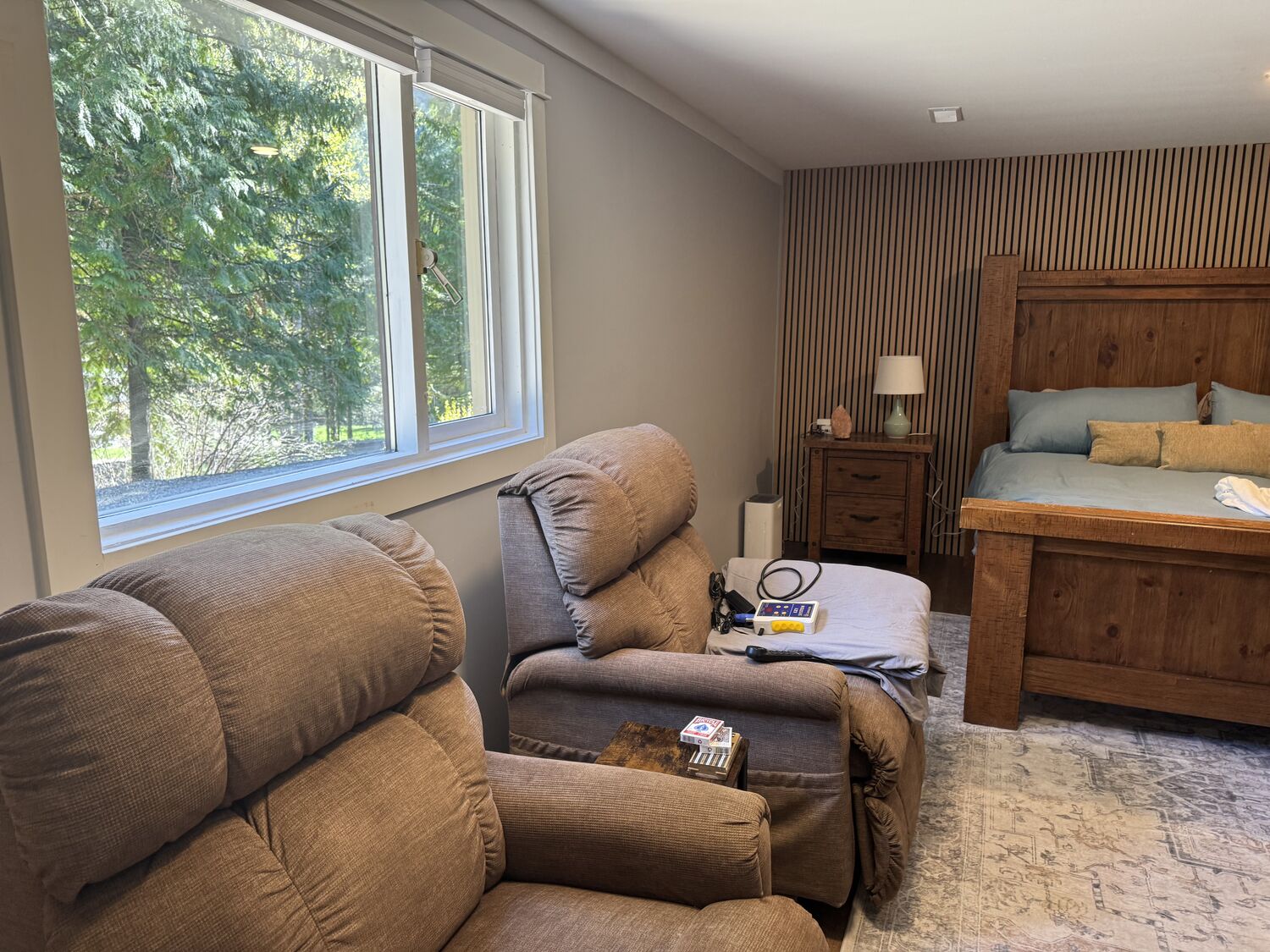 Two recliners by the window in the King Room walk out
