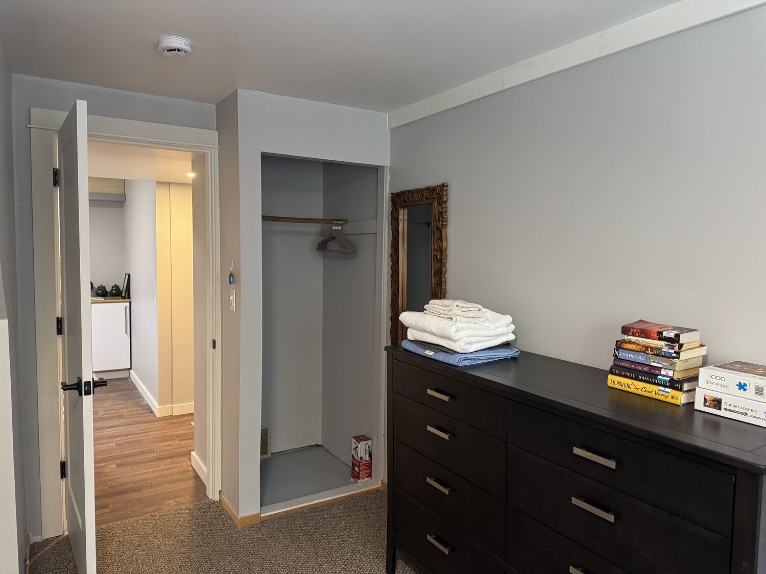 The closet in the Queen Room, with the door through to the shared kitchenette