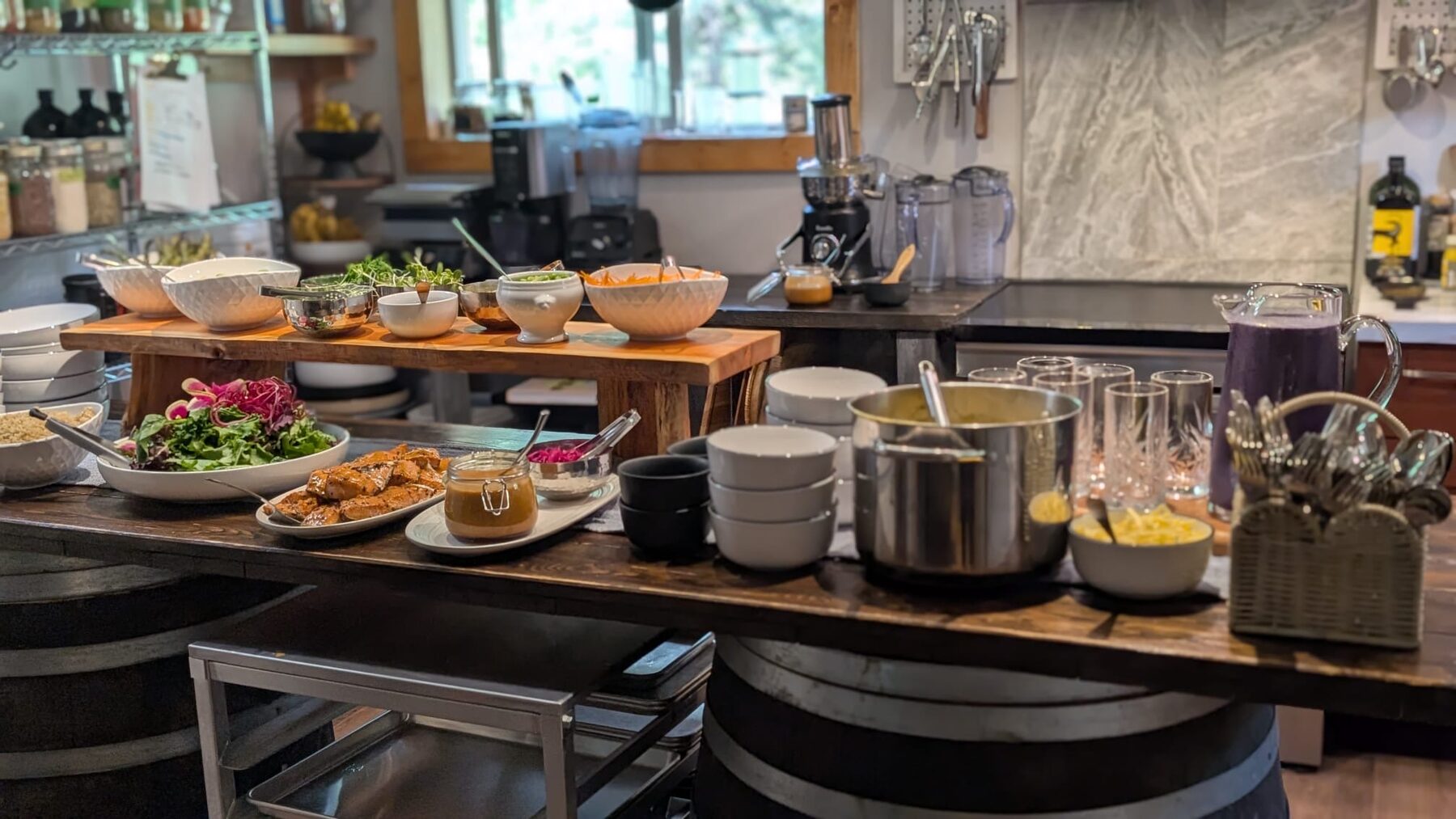 Dinner laid out in The Rock Eatery at The Healing Oasis, salads, mains and fresh juice ready to serve