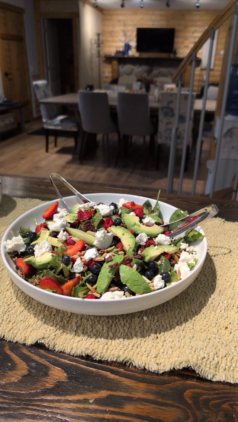 A salad of greens, berries, avocado and goat cheese in a cabin at The Healing Oasis