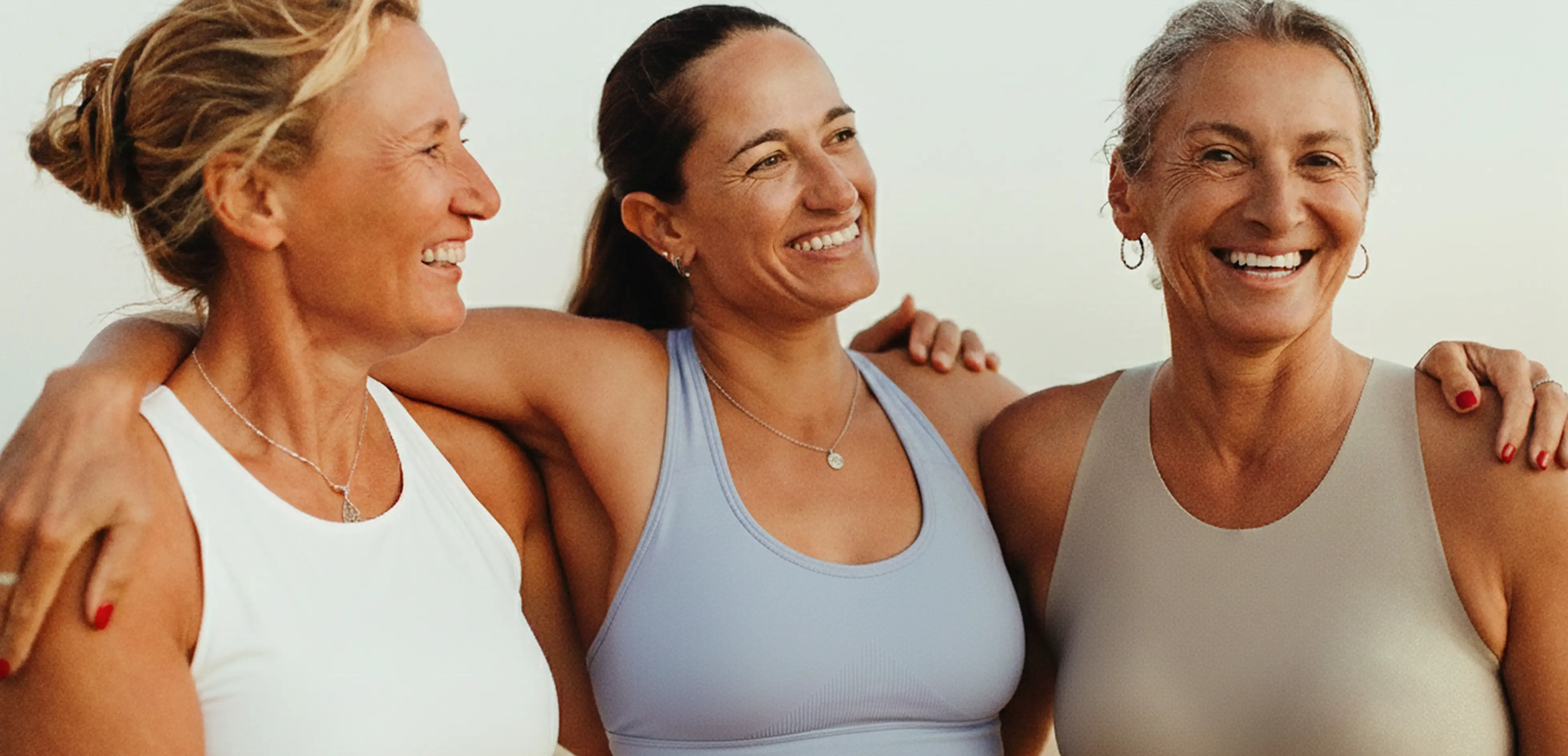 Three woman standing smiling