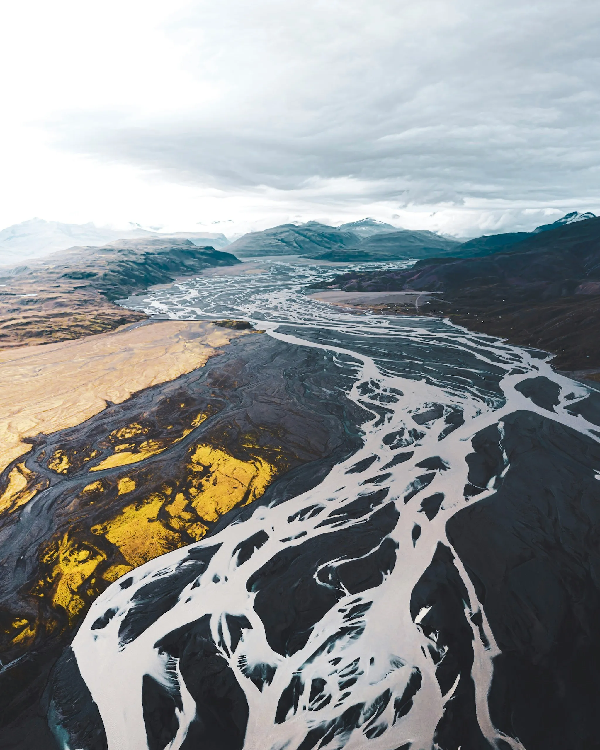 Aerial view of braided river channels across a glacial outwash plain