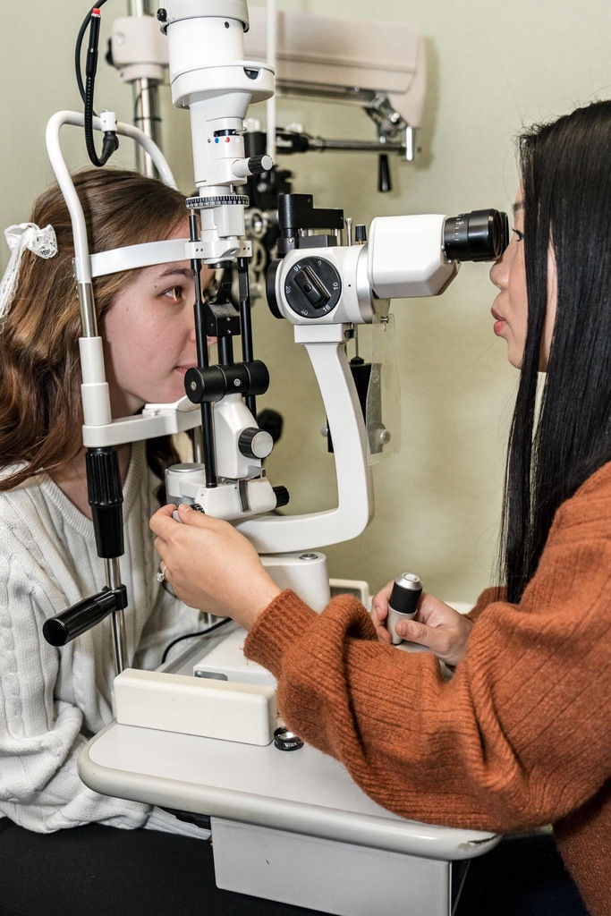 Eye care specialist reviewing a patient case at Active Eyecare of Surprise