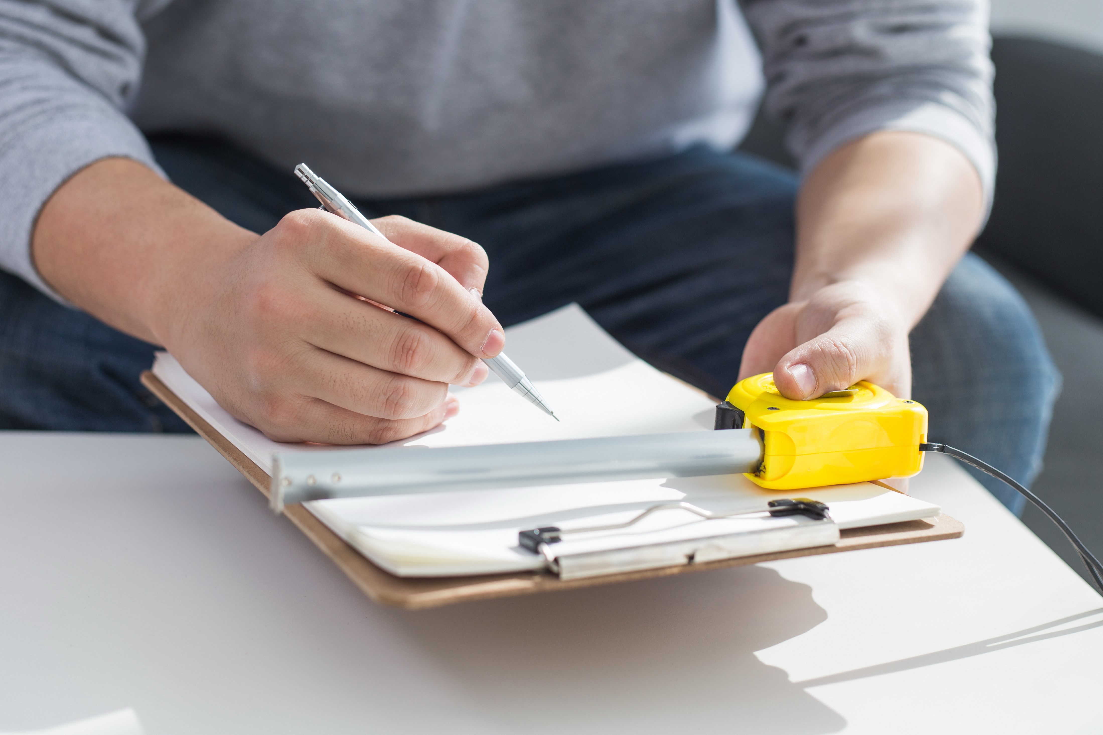 image of notepad and measuring tape
