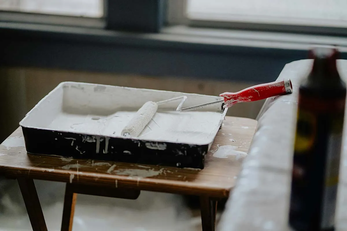A roller tray and roller during house decorating