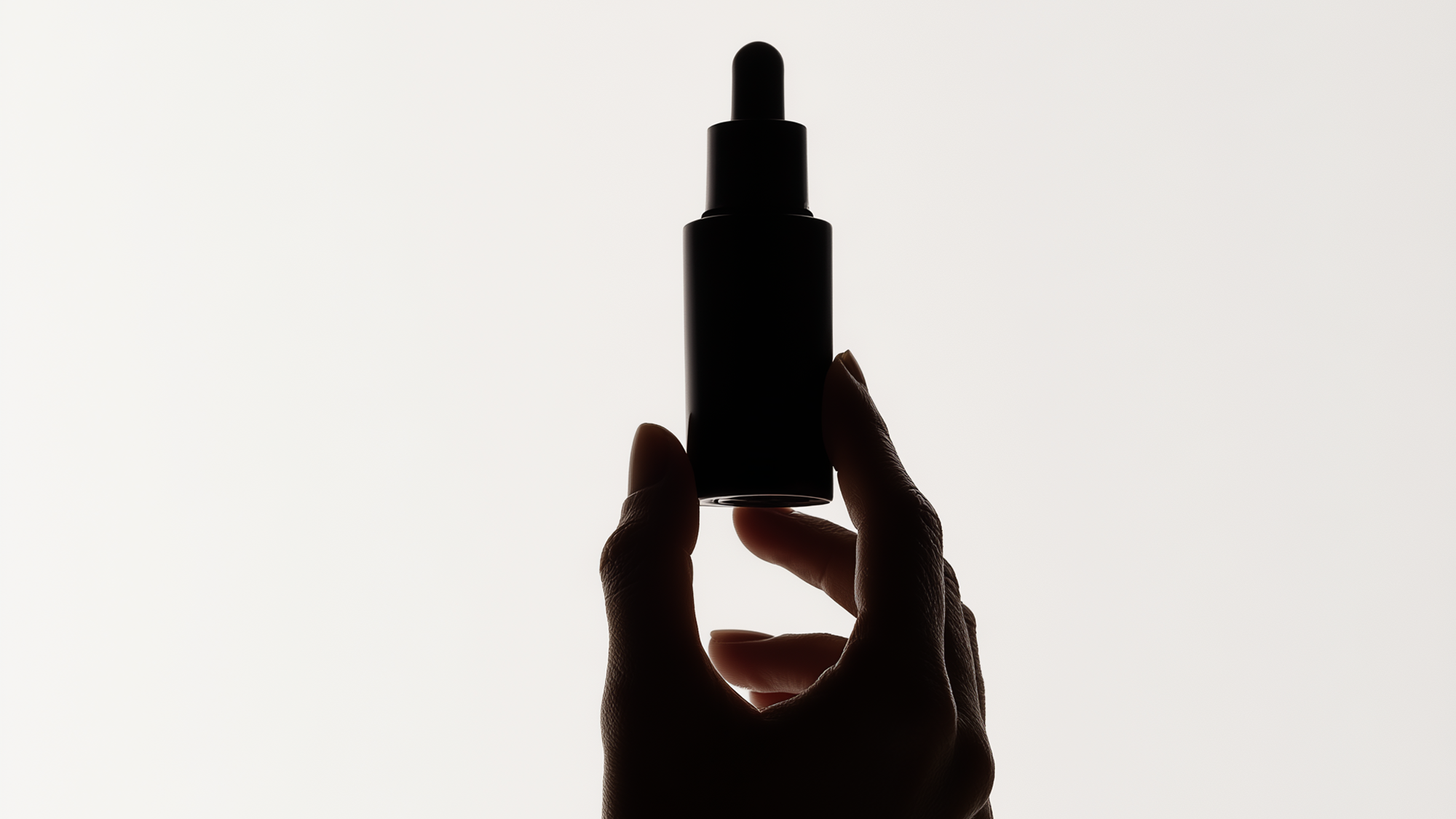 Hand holding a beauty product.