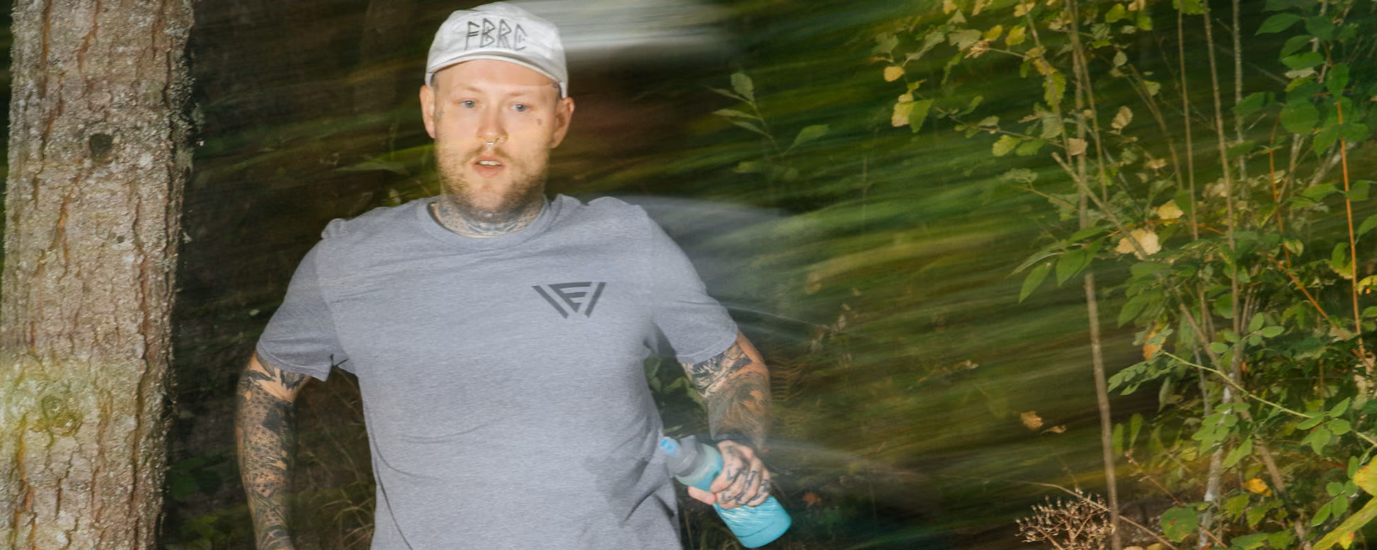 Blurred image of a man running in nature.