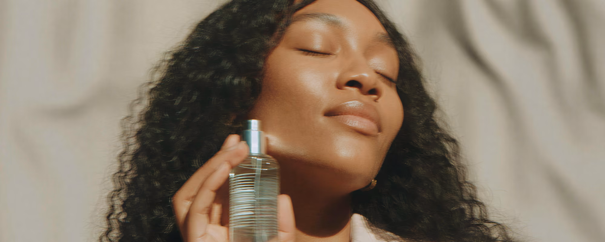 Woman holding a beauty product.