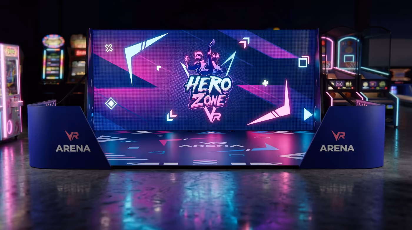 A VR arena setup with a digital screen displaying the Hero Zone VR logo, featuring neon blue and pink lighting effects.