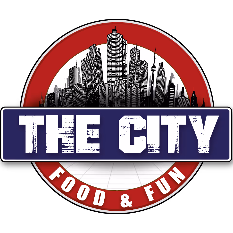 Logo with a black and white city skyline inside a red circle, overlaid by a blue rectangle with distressed white text 'THE CITY' and a red arc below with white text 'FOOD & FUN'.
