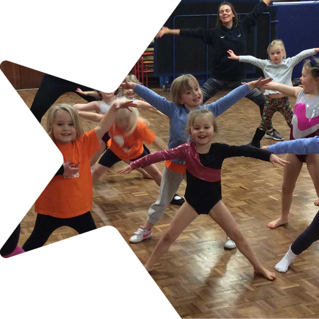 A group of young kids enjoying a class.