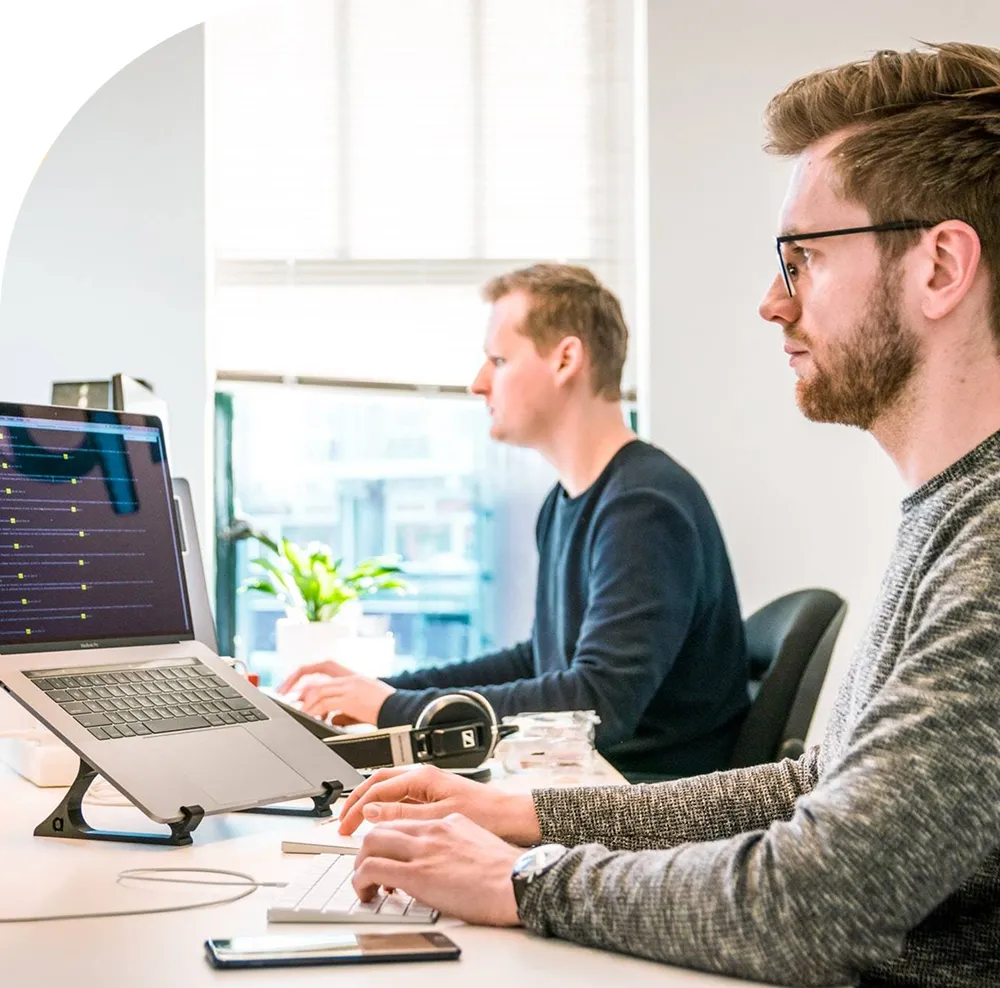 An image showing two men working