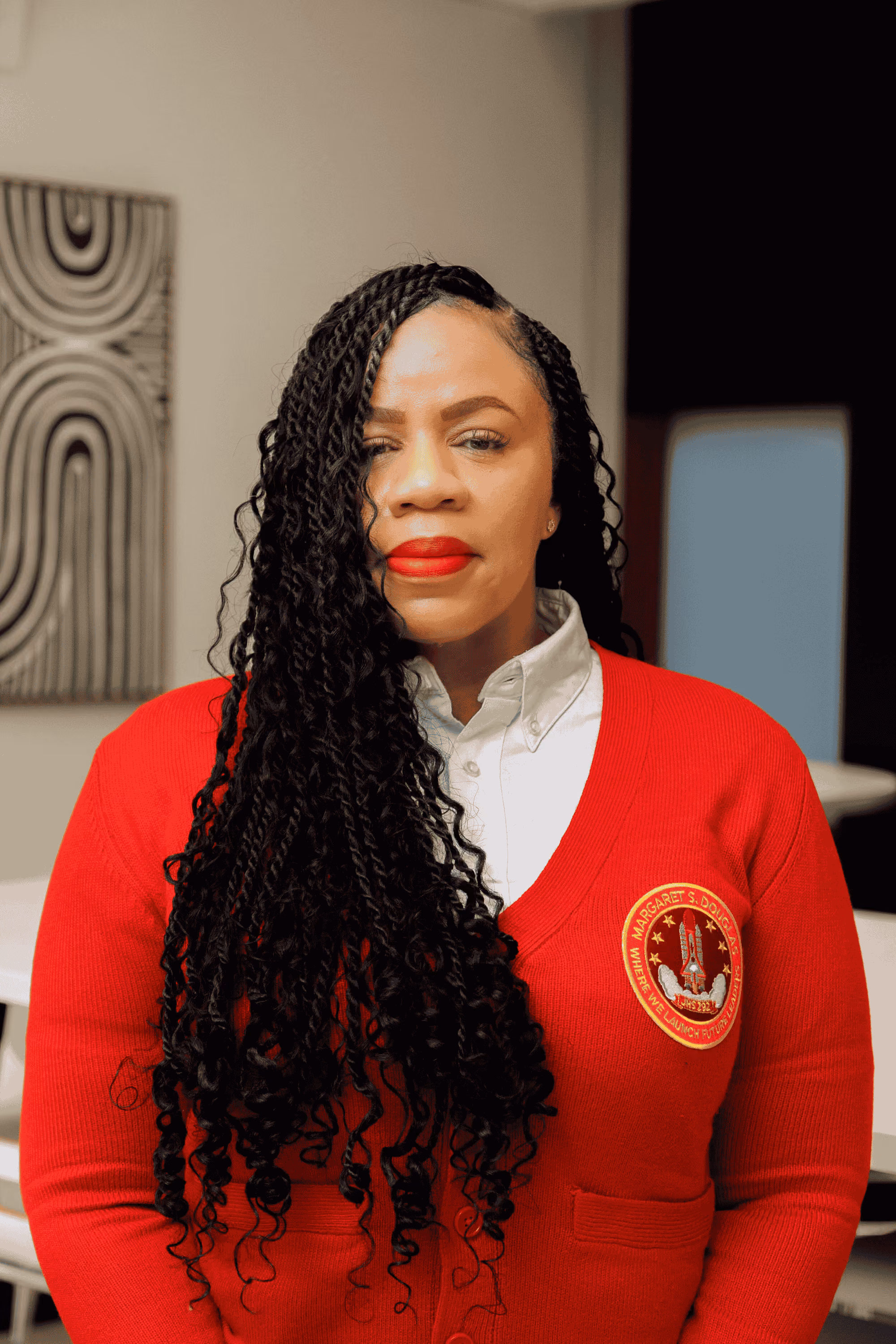 Staff member wearing Margaret S. Douglass school uniform cardigan