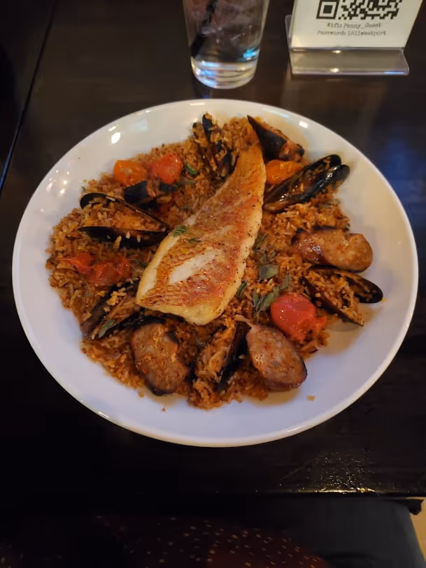 Paella with fish on top