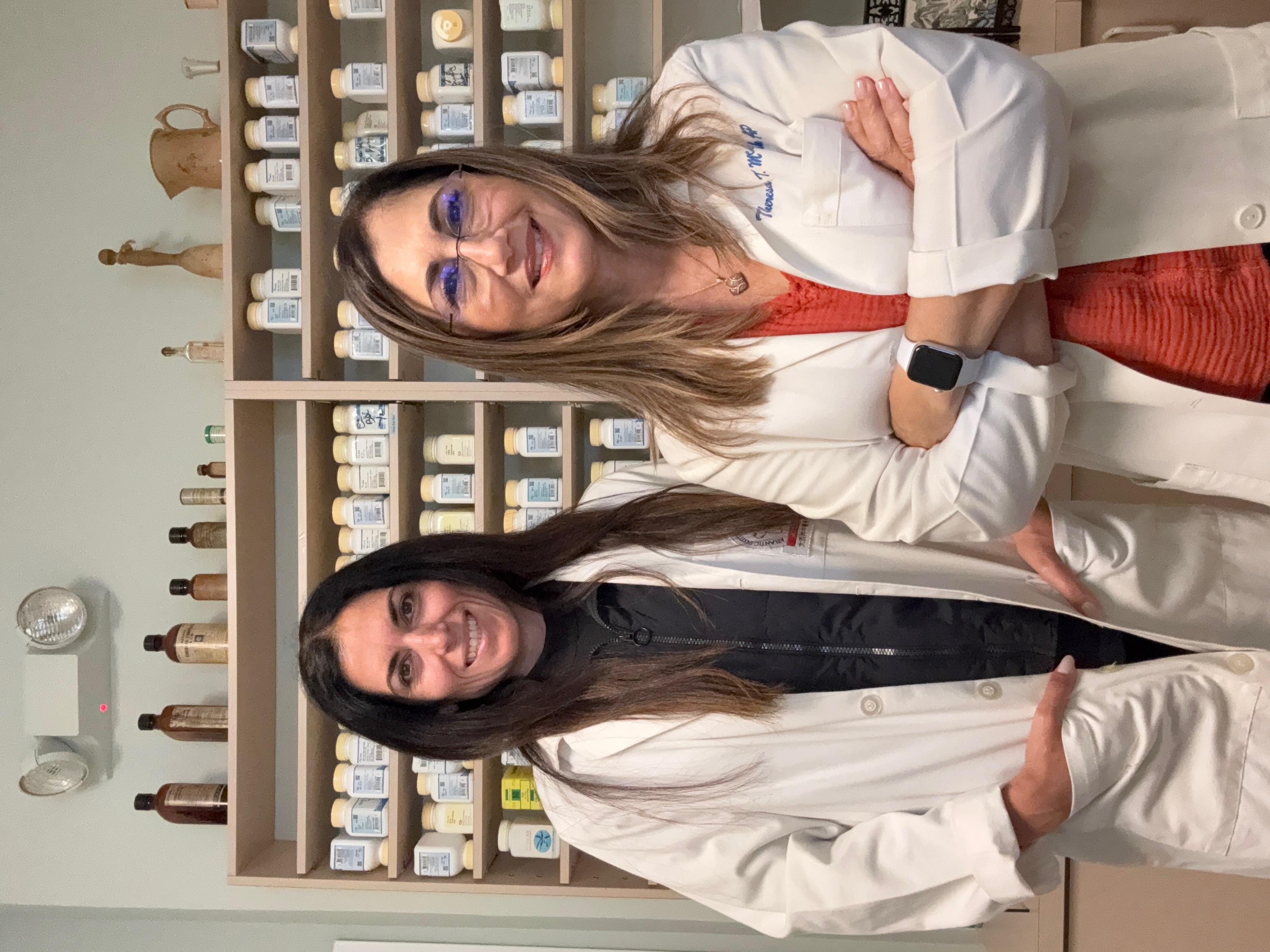 Theresa McIntosh and Jenna Vilardo in white coats - Acupuncture Associates of Plantation