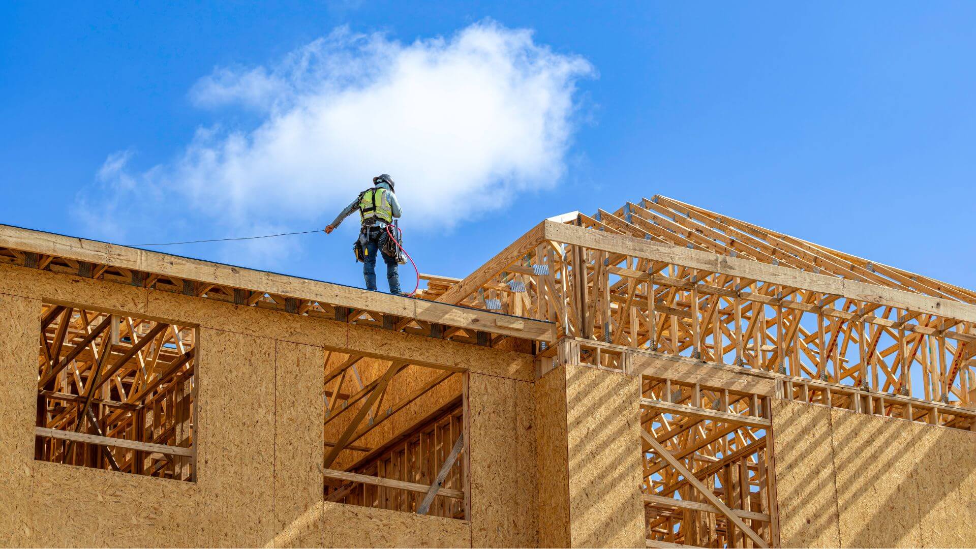 A commercial framing subcontractor wearing safety gear