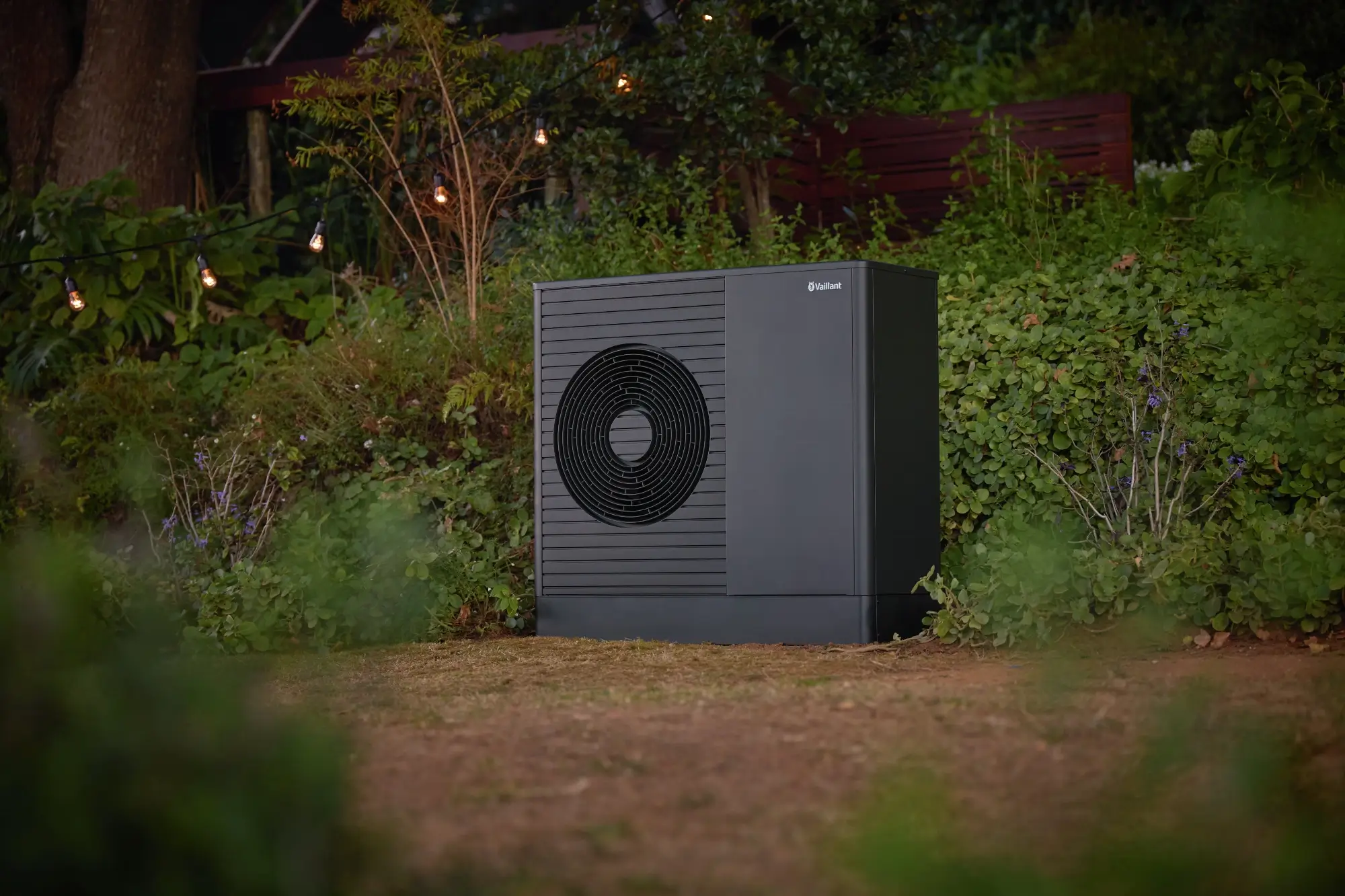 Vaillant's new aroTHERM Plus heat pump in a garden