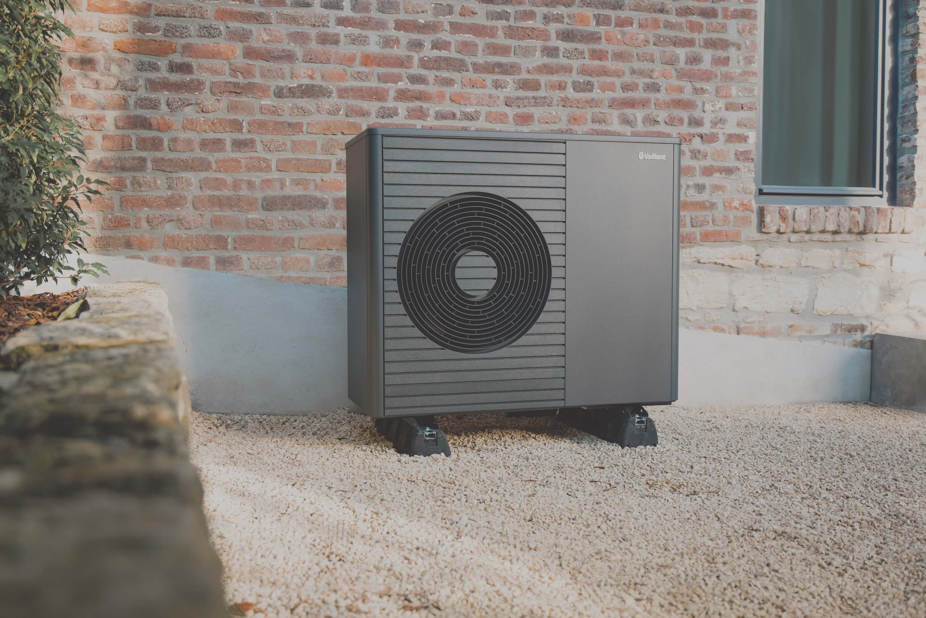 Vaillant's new aroTHERM Plus heat pump in a garden