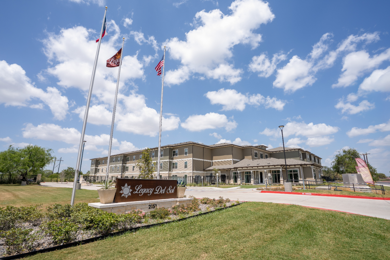 Exterior of leasing office with monument sign
