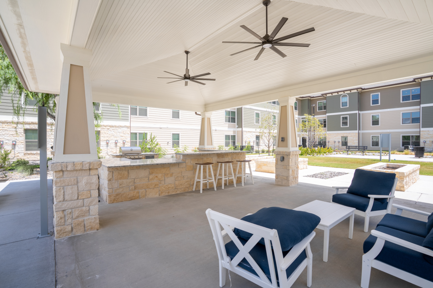 Grill area with seating and stainless steel grill