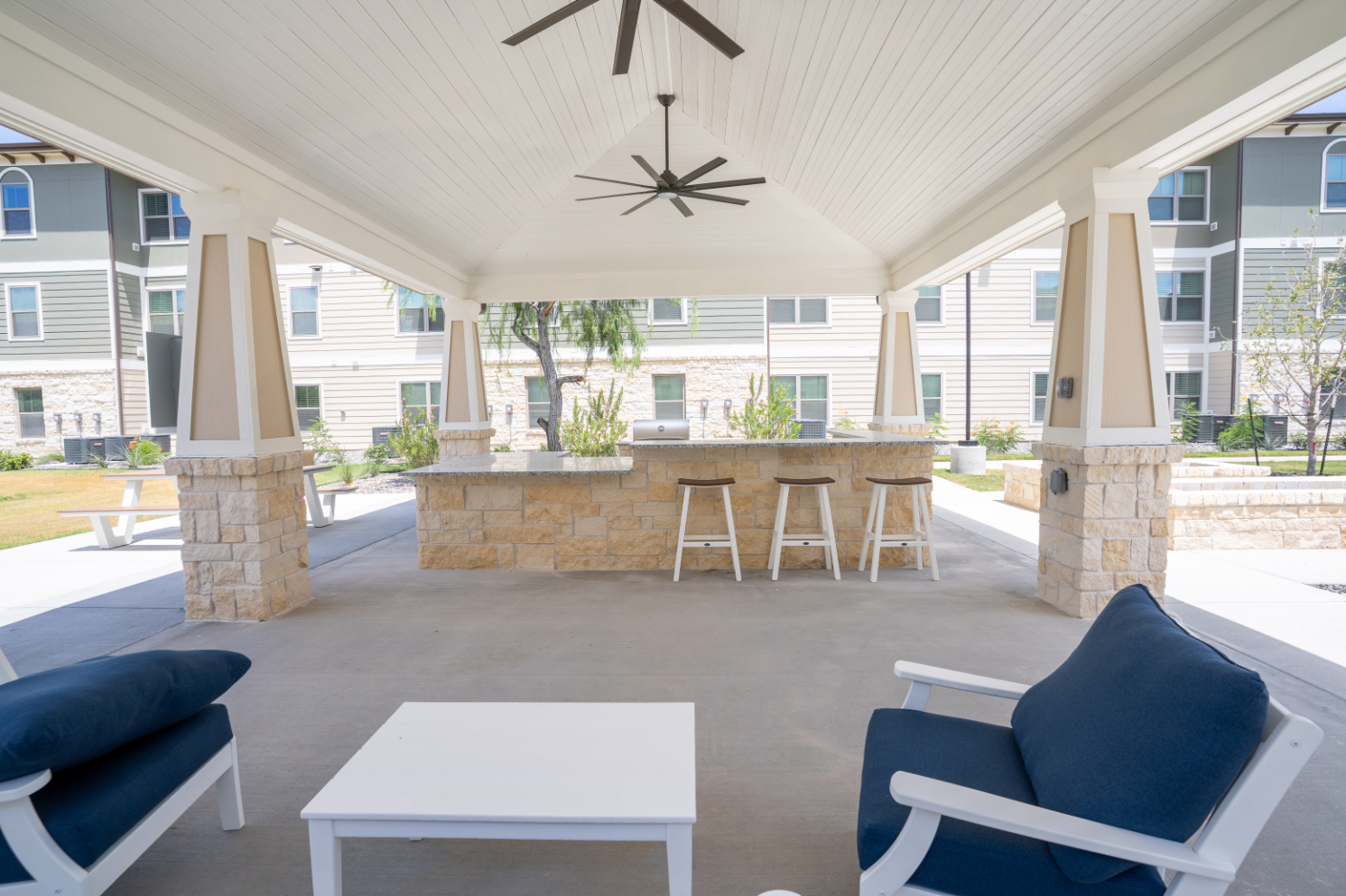 Grill area with seating and stainless steel grill