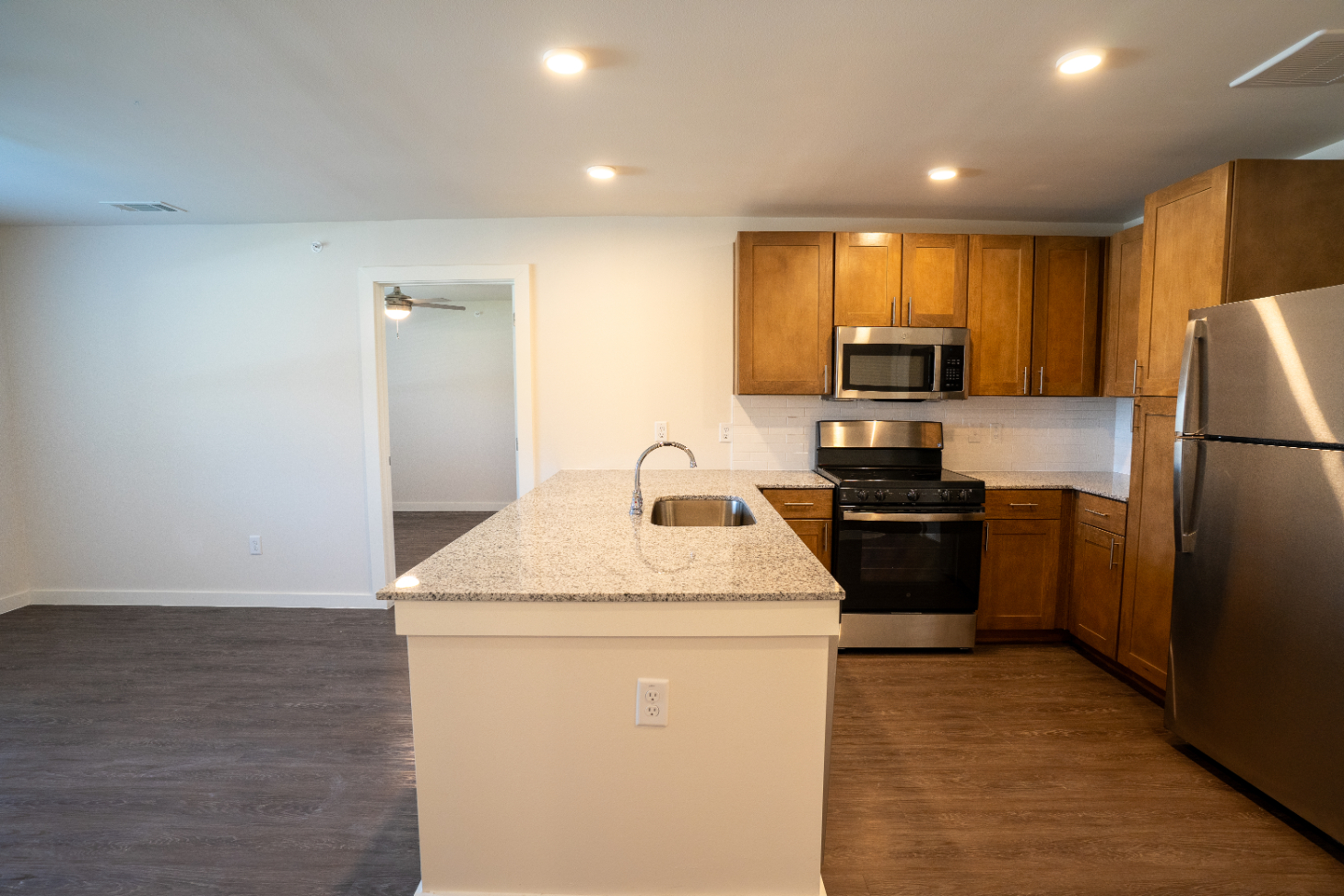 Kitchen with stainless steel appliances and brown cabinets 